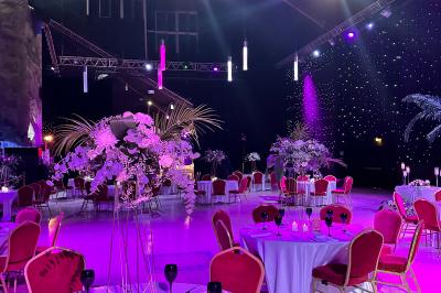 Miniature Location salle Paris 15 (Paris) - La Palmeraie #1 Salle de réception avec tables hautes noires, verres lumineux et éclairage tamisé dans une ambiance festive.