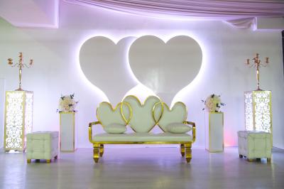 Miniature Location salle Brétigny-sur-Orge (Essonne) - Aya Réception #28 Buffet élégant avec une présentation variée de bouchées salées et sucrées sur des plateaux dorés en salle lumineuse.