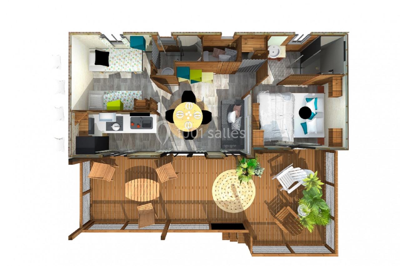 Plan en vue aérienne d'un logement avec deux chambres, un salon, une cuisine, une salle de bain et une terrasse aménagée.