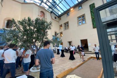 Miniature Location salle Saint-Priest (Rhône) - Château de Saint Priest #19 Façade d'un château historique entouré de pelouses bien entretenues et d'arbres taillés, sous un ciel nuageux.