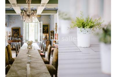 Miniature Location salle Vérargues (Hérault) - Château de Pouget #14 Salle en pierre avec arches, tables décorées et stands alignés, éclairage chaleureux créant une ambiance conviviale.