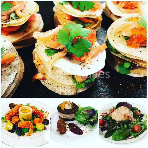 Assortiment de plats gastronomiques comprenant des bouchées raffinées et des assiettes colorées avec des ingrédients variés.