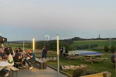 Miniature Location salle Froidchapelle (Hainaut) - Le Refuge du Badon #12 Dépliant sur des trottinettes électriques tout terrain posé sur une table avec viennoiseries et jus d'orange en arrière-plan.