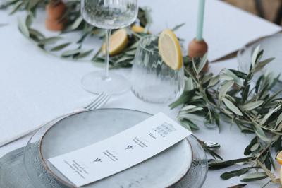 Miniature Mariage en Drôme provençale Bougeoirs en laiton et en métal argenté alignés sur des étagères en bois dans un espace de rangement.