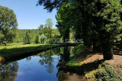 Miniature Location salle Boissy-la-Rivière (Essonne) - Domaine de Bierville #11 Rivière calme bordée d'arbres hauts et verdoyants, reflétant la lumière du soleil dans un environnement paisible.