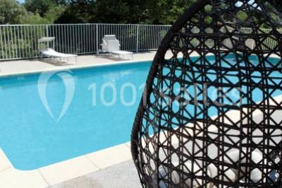 Miniature Location salle Ferrières-les-Verreries (Hérault) - Le Mas de Baumes #8 Montagne rocheuse éclairée par une lumière douce, entourée de collines boisées et d'arbres au premier plan.