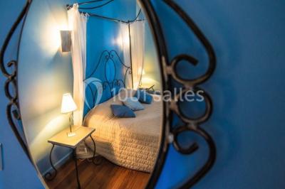 Miniature Location salle Ferrières-les-Verreries (Hérault) - Le Mas de Baumes #15 Montagne rocheuse éclairée par une lumière douce, entourée de collines boisées et d'arbres au premier plan.