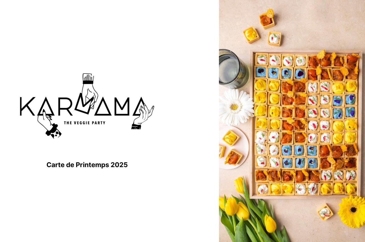 Plateau coloré de bouchées végétariennes variées disposées sur une table avec des tulipes jaunes et des fleurs blanches.