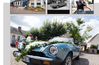 Voiture ancienne décapotable décorée de fleurs pour une cérémonie, stationnée sur une rue pavée.